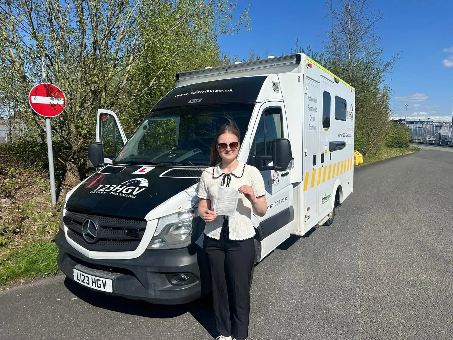 Real learner pass beside the C1 ambulance. C1 learner pass photograph beside an ambulance training vehicle in Wigan